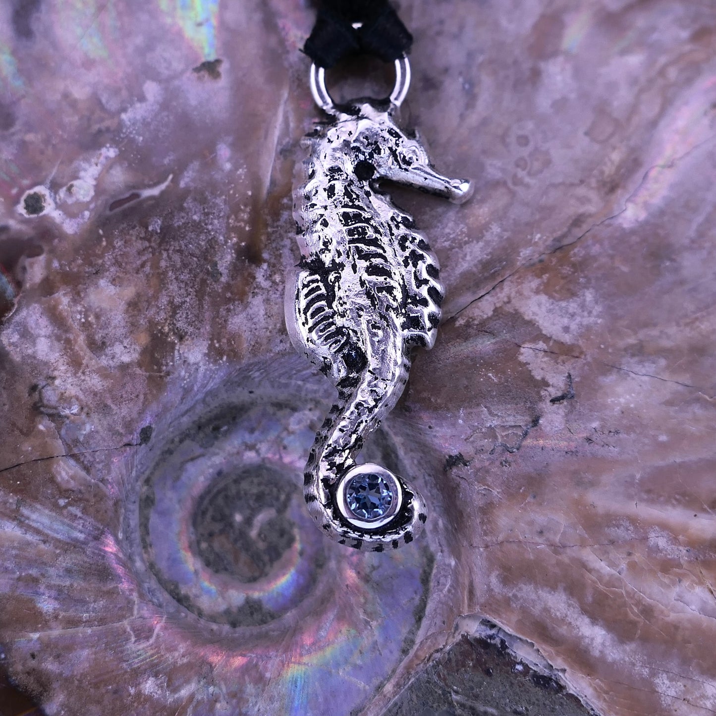 Tidebound Keeper – Blue Topaz Seahorse Pendant in Fine Silver